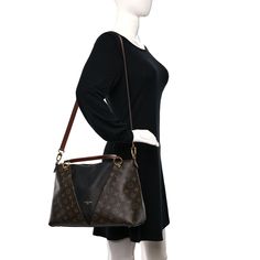 This is an authentic LOUIS VUITTON Monogram V Tote MM in Black. This chic handbag is crafted of Louis Vuitton monogram on coated canvas with black leather trim. The bag features a hidden zippered pocket on the front, polished gold hardware, rolled leather handles, and an optional adjustable leather shoulder strap. The top zipper opens to a black microfiber interior with patch pockets. Oversized Bag, Versace Bags, Dior Jewelry, Chic Handbags, Wallet Fashion, Hobo Handbags, Leather Handles, Luxury Accessories, Bag Straps