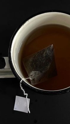 a cup of tea with a rock in it