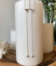 This gorgeous Multi Stone Lariat Necklace is available in 18k gold vermeil and sterling silver. The necklace can be worn on it's own or can easily be layered with other chokers and necklaces. Wear this to any occasion and be ready to shine! This item is also referred to as Y Necklace. MEASUREMENTS The length of the Multi Stone Lariat Necklace is 16 inches around the neck with a 3.5 inch drop and a cubic zirconia charm. Each necklace comes with an additional 2.5-inch extender chain to easily adju Drop Necklace Silver, Silver Lariat Necklace, Lariat Necklace Silver, Pearl Anklet, Zirconia Necklace, Y Necklace, Cubic Zirconia Necklace, Small Jewelry Box, Beaded Anklets