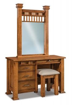 a wooden dressing table with mirror and stool