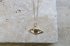 Be one step ahead of the unexpected with our artistic Gold Evil Eye Necklace bringing karma and luck. Cast in recycled 14k yellow gold and made to order, carved by hand in wax by Jessica Hung from a handmade 18" 14k gold chain. Weighs approx. 3.4 grams We will be donating a portion of sales of this necklace the the Palestinian Children's Relief Fund which provides urgent humanitarian and medical aid to children in Gaza and occupied Palestine. This evil eye necklace can be purchased alone as a ch Gold Evil Eye Pendant Jewelry, Yellow Gold Evil Eye Medallion Jewelry, Gold Medallion Necklace With Evil Eye, Gold Spiritual Necklace With Diamond Eyes, Yellow Gold Medallion Jewelry With Evil Eye, Yellow Gold Jewelry With Evil Eye Medallion, Gold Amulet Jewelry With Diamond Eyes, Gold Evil Eye Amulet Jewelry, Yellow Gold Evil Eye Jewelry For Good Luck