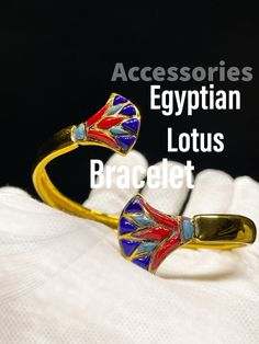 Amazing Collectibles! Egyptian brass Lotus bracelet. Premium quality. Handmade from Brass with amazing Gold 24k karat, Specially made for you ;) A very unique piece you will never find it anywhere ;) Note: You can use this bracelet whatever the size of your hand because it is a free size bracelet Ancient sculpture replica from the original one, 100% Egyptian HAND MADE Made from Brass. Contact Us: It's always our pleasure serving you. Please do not hesitate to contact us through inbox or email for an amazing shopping experience. Shipment: Enjoy a marvelous and 100% Secured Packaging. Returning Policy: If you are not 100% satisfied with your purchase, you can return the product and get a full refund or exchange the product for another one (only pay the shipping cost). You can return a produc Luxury Adjustable Brass Bracelets, Luxury Handmade Adjustable Bangle, Collectible Gold Jewelry With Unique Design, Gold Bangle With Unique Design, Brass Jewelry With Bracelet Strap As Gift, Brass Bracelet Strap Jewelry For Gifts, Brass Jewelry With Bracelet Strap Gift, Brass Bracelet Strap Jewelry Gift, Luxury Handmade Ceremonial Bracelets