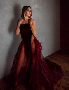 The definition of an alluring gown designed for an Extraordinary Women. Burgundy Velvet with sheer side. Gown features hand beading, feathers on the hips and a small train. Custom Made to Order Please allow up to 12 weeks after final fitting. Gown can be made in custom colors. Choose from our stock sizes or have this gown custom made to your specifications. First shown on the Omaha Fashion Week Runway. It's ready to make you turn heads at your next event. Extraordinary Women, Fashion Week Runway, 12 Weeks, Hand Beading, Red Formal Dress, Custom Color, Feathers, Beading, Custom Made