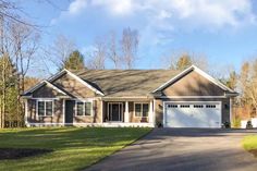 a large house with a driveway in front of it