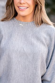 This cropped sweater features a round neck and dolman sleeves for a relaxed and stylish look. The cropped length adds a modern and trendy touch to the design. The dolman sleeves provide a comfortable and loose fit, perfect for effortless chic styling. With its versatile round neck, this sweater can be easily paired with different bottoms for various outfits. The cozy knit fabric makes it a great piece for staying warm and fashionable in cooler weather. Overall, this round neck dolman sleeve crop Chic Cropped Crew Neck Sweater For Layering, Oversized Cozy Cropped Sweater With Ribbed Neckline, Cozy Oversized Cropped Sweater With Ribbed Neckline, Oversized Cropped Sweater With Ribbed Neckline, Trendy Relaxed Fit Cropped Sweater For Layering, Fall Cropped Sweater With Ribbed Neckline For Loungewear, Chic Ribbed Cropped Sweater With Crew Neck, Trendy Sweater With Ribbed Neckline For Layering, Trendy Crew Neck Cropped Sweater In Soft Knit