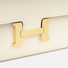 The Hermes Constance To Go Wallet is the perfect accessory as it is sleek, stylish and sophisticated. This wallet can easily hold all your cards, bills, change and receipts with a removable shoulder strap that transforms this iconic style into a multi-functional piece. Remaining a true investment piece that will never lose its value, not only beautiful and chic, but it is one that you will never fall out of love with. SPL Exterior  Nata Epsom Leather  Gold tone hardware  Hermès logo stamp ‘H’ tab closure Removable and non-adjustable leather thin shoulder strap Slip pocket at rear Date Code U - 2022 Production Brand New Condition   Interior  Smooth leather interior   Two open compartments Large middle zip pocket Four card slots Two slip pockets Brand New Condition  Sold with box, felt, shou Hermes Constance To Go, Fall Out Of Love, Out Of Love, Falling Out Of Love, Hermes Birkin 30, Hermes Constance, Iconic Style, Rose Gold Hardware, Dior Shoes