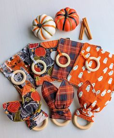 an assortment of pumpkins and baby toys on a table