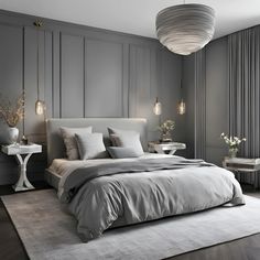 a bedroom with gray walls and white bedding in the center is a round chandelier