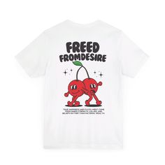 Step back in time with a touch of playful nostalgia with our "Freed From Desire" t-shirt. This vintage-inspired tee features the iconic phrase "Freed From Desire" paired with a whimsical illustration of two cherries dancing joyfully. The retro cartoon cherries bring a fun, carefree vibe, symbolizing the liberation and joy. The design, with its vibrant colors and vintage charm, stands out against the fabric, making it a statement piece that echoes both style and a deeper message of freedom from s Music-themed Short Sleeve T-shirt With Front Print, Graphic Tee With Logo For Music Festivals, Graphic Tee With Logo Print For Music Festivals, White Music-themed T-shirt With Text Print, Music-themed Text Print T-shirt For Streetwear, White T-shirt With Text Print For Music Festivals, White Text Print T-shirt For Music Festivals, White Graphic Tee For Music Festival, Retro Music Festival T-shirt With Text Print