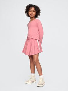 Soft cotton-blend shirt and skort set.  Crewneck.  Long sleeves.  Elasticized waist with drawcords.  Flutter skirt.  Inner shorts.  Straight, easy fit.  Hits at the hip.  Easy pull-on waist.  Easy through the hip and thigh. Skort Set, Skort Outfit, Gap Kids, Outfit Set, Toddler Gifts, Gap, Cotton Blend, Long Sleeves, Crew Neck