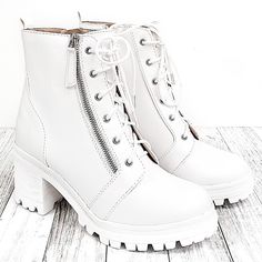 Update Your Outfit With These Newly Arrived Lug Sole Combat Boots New In Box Vegan Leatherette Material Decorative Side Zipper Inner Side Zipper For Easy Shoe Removal Lightly Padded Insole Comfy Stacked Chunky Heels Heel Height: 2.5 In. Platform Height: 1 In. Boot Height: 7.5 In. Fitting: True To Size. Regular Foot Width. White Platform Lace-up Heeled Boots, White Lace-up Platform Heeled Boots, White Ankle-high Lace-up Boots With Lug Sole, White Ankle-high Heeled Boots With Padded Ankle, White Padded Ankle Platform Boots, White Heeled Boots With Padded High Ankle, White High Ankle Heeled Boots With Padded Ankle, White Lace-up Ankle Boots With Reinforced Heel, White High-top Moto Boots For Spring