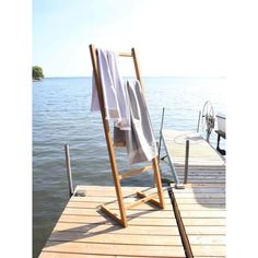 a towel is hanging on the end of a wooden dock