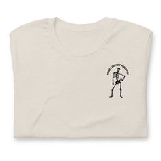 a white t - shirt with an image of a skeleton holding a cup in it's hand