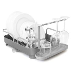 a dish rack with dishes and utensils in it