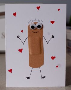 a handmade card with a cartoon character on it's face and hands holding hearts