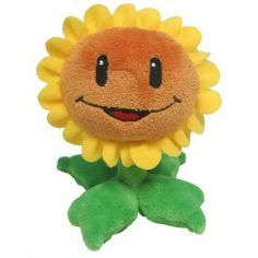 a yellow and green stuffed sunflower with a smile on it's face, sitting upright