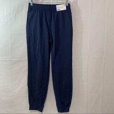 Size Small: 26-27” Waist - Crisp Fabric For A Flattering Fit. - Made With Ultra Stretch Fabric. - Quick-Drying Dry-Ex Technology. - Sleek, Streamlined Cut. - Basic Color Goes With Any Style. Fitted Blue Joggers With Pockets, Blue Full Length Sweatpants With Pockets, Stretch Blue Joggers With Pockets, Blue Mid-rise Activewear For Loungewear, Blue Stretch Joggers With Pockets, Blue Straight Leg Joggers With Elastic Waistband, Blue Tapered Leg Sweatpants With Elastic Waistband, Blue Activewear Pants With Pockets, Blue Stretch Tapered Leg Sweatpants