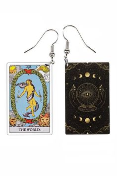 two taroti cards hanging from hooks on a white background, one with an image of the moon