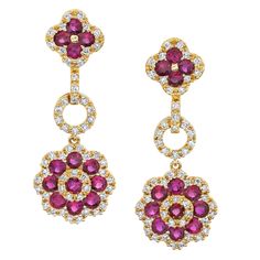 These sparkling drop earrings feature round rubies and diamonds arranged in an elegant yet playful floral pattern and set in 18k yellow gold. The ruby clusters are framed with beautiful diamond borders for eye-catching sparkle and contrast. They are a perfect size for day or evening, and the design makes them so versatile! Wear them with something casual for a party, or with a black dress for a candlelit dinner! Fun, timeless, and ready to celebrate! 26 rubies, 1.57 carat total Round brilliant-c Rubies And Diamonds, Candlelit Dinner, Ruby Jewelry, Pearl Earrings Dangle, Diamond Flower, Antique Earrings, Gold Flower, Lovely Jewellery, Diamond Drop Earrings