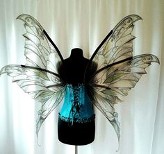 a mannequin dressed as a fairy with wings