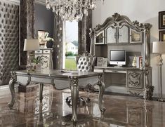 an elegant desk and chair in a room