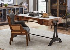 an old fashioned desk with a typewriter on it in a room filled with furniture