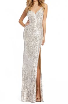 Steal the show in this column gown covered in fiery sequins with a deep V-neck, soaring side slit and elegant train. 62 1/2" length Back zip closure Deep V-neck Sleeveless Get the perfect fit—book an appointment with one of our alterations experts Lined 100% polyester Spot clean Imported Women's Clothing Long Sequin Dress, Sheath Gown, Eve Dresses, Sleeveless Gown, Column Gown, Sequin Gown, Runway Trends, Mac Duggal, Crepe Dress