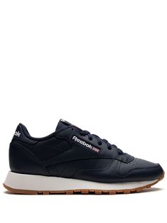 navy blue leather panelled design embroidered logo to the side logo patch at the tongue branded heel counter perforated toebox round toe front lace-up fastening rubber sole These styles are supplied by a premium sneaker marketplace. Stocking only the most sought-after footwear, they source and curate some of the most hard to find sneakers from around the world. Reebok Classic Leather Sneakers, Navy Blue Design, Reebok Classic Leather, Lipstick Bag, Chain Strap Bag, Oversized Tote Bag, Reebok Sneakers, Embroidered Shoes, Floral Shoes