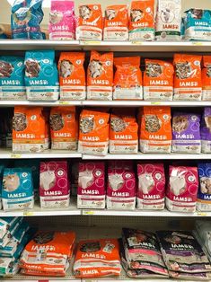 an assortment of dog food on display in a pet store