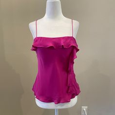 Beautiful Pink Silk Top With Camisole Straps. Ruffle Detailing Around The Chest Line And Back. Ruffle Down The Side. Pullover Styling. Lined. Length Is 23”. Never Been Worn. Original Tags. In Great Condition. Pink Fitted Sleeveless Camisole, Pink Fitted Camisole, Fitted Ruffled Tank Camisole, Fitted Ruffle Tank Camisole, Pink Ruffled Cami Tank Top, Fitted Ruffle Camisole Top, Feminine Pink Camisole With Ruffled Straps, Pink Ruffled Straps Party Top, Pink Ruffled Straps Top For Party