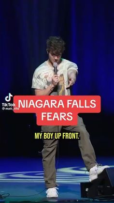 a man standing on top of a stage with a microphone in his hand and the caption says niagara falls tears my boy up front