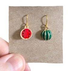 Fruit Earrings, Watermelon Earrings, Weird Earrings, Novelty Earrings, Food Earrings, Cool Earrings, Aesthetic Earrings, Fun Earrings, Green You will love these adorable enamel watermelon earrings, bright in colour and so cute.    🍄 SIZE : approximately 2.5cm drop. 🍄 MATERIALS: watermelon enamel charm, handmade gold plated ear wires. 🍄 DESPATCH TIME: Posted next working day. 🍄Your Bonnie Wishes Jewellery will come wrapped in tissue paper with a lovely sticker and will be posted in a strong postal box to ensure your order reaches you in perfect condition. 🍄 I source all my premium quality jewellery findings worldwide, I only use lead and nickel free metals, genuine gemstones and crystals.  🍄 Ear wires are available in non pierced, hook  and lever back at no extra charge, just let me k Cool Earrings Aesthetic, Earrings Weird, Weird Earrings, Watermelon Earrings, Earrings Cool, Earrings Food, Cool Earrings, Aesthetic Earrings, Novelty Earrings