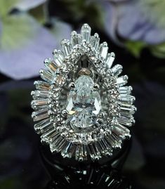 a diamond ring sitting on top of a table