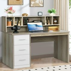 a laptop computer sitting on top of a desk next to a book shelf filled with books