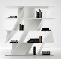 a white book shelf with books on it