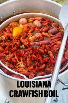 a bucket full of crawfish and potatoes with the words, louisiana crawfish boil