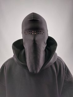 Inspired by minimalist haute couture solutions. Blank black balaclava made from 100% cotton with raw edges in one size with holes.