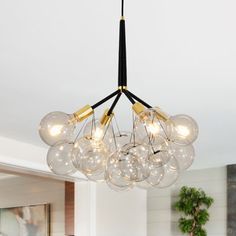 a chandelier hanging from the ceiling in a living room