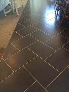 the kitchen floor is clean and ready to be used as a dining room or family room