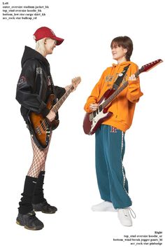 two young men with guitars standing next to each other