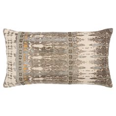 a decorative pillow with an intricate design on the front and back, in grey tones