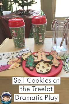 some cookies are on a table with candy canes and other items in front of them