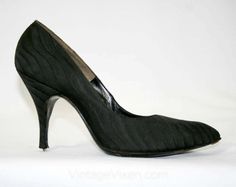 Masterfully crafted black shoes in fine silk brocade, these early-mid 1950s stilettos have an exquisitely chic silhouette with 4-inch heels, a plump pointed toe and careful craftsmanship. Size Marked 6 1/2 A Measurements Ball of Foot Width 2 3/4, Toe to Heel Length 9 7/8 Inches Era 1950s Label ' De Liso Debs / DESIGNED BY / PALTER DELISO ' and ' custom / lasted ' stamped in gold to insole Materials Black silk satin brocade in a wavy fine-textured stripe effect, black leather insoles and outsoles Retro Round Toe Evening Heels, Retro Round Toe Heels For Evening, Retro Almond Toe Fitted Court Shoes, Retro Fitted Almond Toe Court Shoes, Retro Evening Heels, Retro Heels With Pointed Toe For Vintage Fashion, Vintage Fitted Court Shoes With Round Toe, Retro Pointed Toe Heels For Vintage Fashion, Retro Pointed Toe Heels For Vintage Occasions