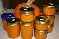 pumpkins and jars are sitting on the counter