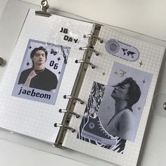 an open notebook with pictures of people on it