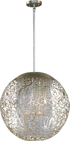 a light fixture with an intricate design on the front and back sides, hanging from a metal rod