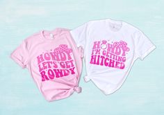 Howdy I'm getting hitched and howdy let's get rowdy bachelorette country shirts. UNISEX SHIRT - 100% cotton - 52% cotton / 48% polyester for some colors - Bella + Canvas brand - Relaxed fit - Size up for a baggier fit Pink Cowgirl Hat, Country Bachelorette, Bridesmaid Shirt, Getting Hitched, Pink Cowgirl, Bridesmaid Shirts, Cowgirl Hat, Pink Cow, Bachelorette Shirts