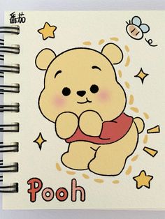 a notebook with an image of pooh on it