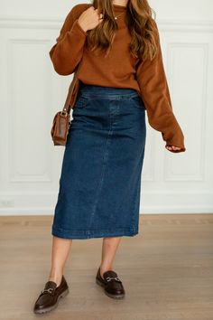 Add a little flair and contrast to your outfit with the 'Margaret' denim mid skirt! This midi skirt features stretch denim and a flattering silhouette for a comfortable fit all day. Pair with a fitted top and white sneakers for a fun and casual ensemble for a day out at the park! Exclusively designed by us with you in mind. 97% Cotton, 3% Spandex Hand Wash Cold Hang or Lay Flat to Dry Iron Low Heat Do Not Bleach Do Not Dry Clean Functional front & back pockets! Slight flared/A-Line Style Model H Midi Skirt Outfit, Mid Skirt, Layered Tops, Fitted Top, Denim Midi Skirt, Skirt Outfit, Skirt Leggings, Fall 2024, Blouse Dress