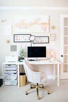 a white desk with a computer on top of it